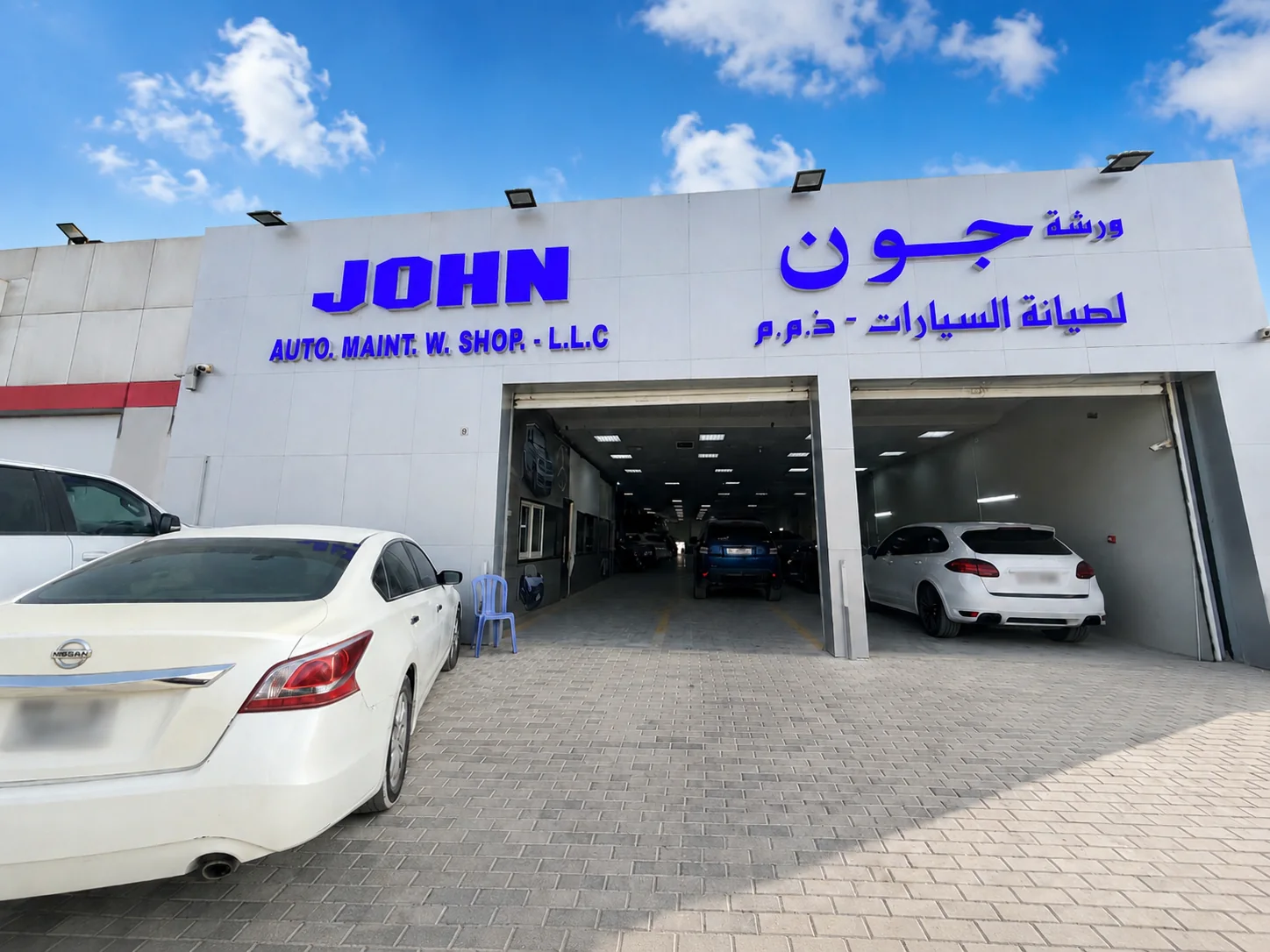 John Auto workshop exterior and illuminated signage