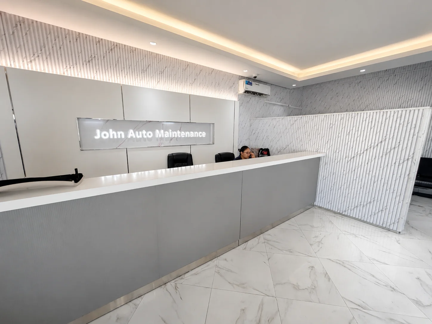 Customer reception desk at John Auto Maintenance Workshop